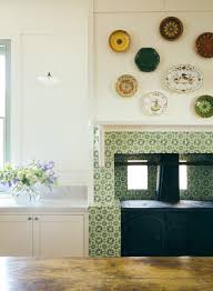 Faceless cabinets are a european style of cabinets with the doors of the cabinet hinged from the cabinet sides. Kitchen Wood Island Hanging Plates Marble Countertops White Cabinetry Sorrento Beach House Anna Spiro Interior Design Katie Considers