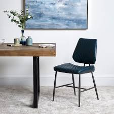 A New Take On A Classic Design The Digby Dining Chair Has Been Crafted From Metal And Dark Blue In 2020 Leather Dining Room Chairs Faux Leather Chair Dining Furniture