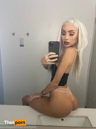 Naomi Woods poses provocatively in lacy underwear