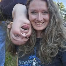 What is the revised Homecoming parade route in Holly, MI?