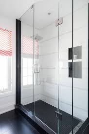 This is a reasonably large shower about 70 inches long and 50 wide. Black Grid Tiled Shower Niches With White Tiles Transitional Bathroom