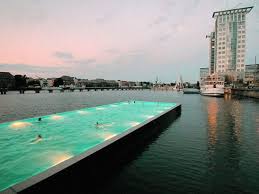 The Badeschiff Created From A Recycled River Cargo Container And Floating On The River Spree Is One Of Berlin S Mo Amazing Swimming Pools Pool Container Pool