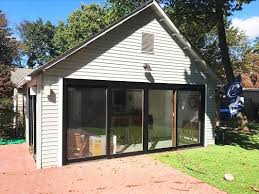 Quick answers to common garage door questions. Sliding Glass Doors Transform Garage Into Beautiful Pool House