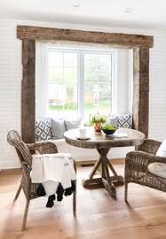 If you don't want to hang actual stone or brick, consider getting a textured wallpaper to give the illusion and save a lot of time! Rustic Beam Breakfast Nook Home Decor Tips Rustic House Home Decor