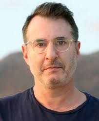 Nicholas Alexander Chavez as Father Charlie Mayhew