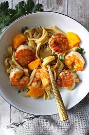 Shrimp And Scallops With Orange Cream Sauce Over Fettuccini Recipe In 2020 Healthy Meat Recipes Italian Cuisine Recipe Scallop Recipes