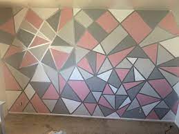 Use a roller to fill in the shape (the roller will help keep a consistent texture to the wall). Triangle Geometric Accent Wall Pink Accent Walls Geometric Wall Paint Wall Paint Patterns