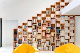 Stepped Shelving Creates Storage In Bookshelf House By Andrea Mosca A bookcase divider doesn't always have to be ceiling tall or wide either.