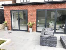 A Stylish And Contemporary Garden Design That Joins Onto A Modern Kitchen Extension In 2020 Garden Room Extensions Modern Kitchen Extensions Open Plan Kitchen Dining
