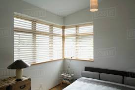 Find out all configurations, upholstery covers and prices. Contemporary Bedroom With Gray Bed And Corner Windows Stock Photo Dissolve