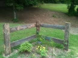 Every time i drive by a house with a split rail fence i look for a horse running in the pasture beyond the fence. Corner Fence Made From Recycled Barn Lumber News Bubblews Driveway Entrance Landscaping Front Yard Landscaping Driveway Landscaping
