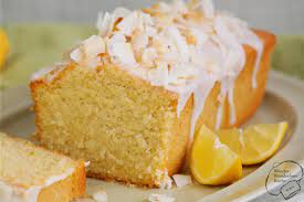 saftiger kokos zitronen kuchen aus der kastenform mit zitronenguss kokosmilch und kokosflocken sehr saftig und fruchtig zitronen kuchen kuchen kuchen rezepte