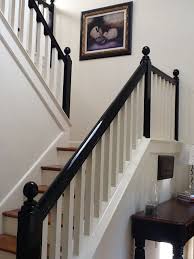 White Entryway With Stairway With Black Banister Black Stair Railing Black Banister Staircase Design