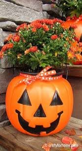 Dress up a pumpkin bucket in a halloween costume of its own. Plastic Pumpkins Fall Planters Crafty For Home
