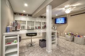 Keep an old magazine/newspaper rack in the craft room for messy projects. She Spends So Much Time In This Craft Studio That We Installed A Smart Tv On The Wall So She Could Stay In Tou Craft Room Sewing Room Design Finishing Basement