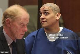 Jose Zapien looks past his attorney Patrick Lake, left, as he listens...  News Photo