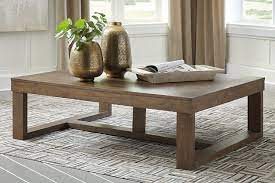 Casters on the legs provide added flexibility. Cariton Coffee Table Ashley Furniture Homestore