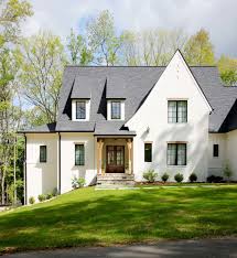 The dark wood garage really complements the home's white exterior making the white really pop. Why We Chose Sherwin Williams White Duck For Our Exterior Paint Color Plank And Pillow