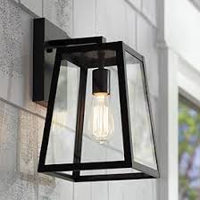 An exterior wall sconce with a trim profile will add illumination to your front door and style to your home. Outdoor Wall Lights And Sconces Entryway Patio More Lamps Plus