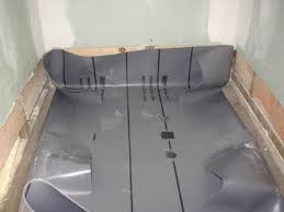 The drain is typically centrally located in newer shower units. How To Install A Shower Pan Liner Photos Pvc Liner Installation For Ceramic Tile Showers Tile Yo Shower Plumbing Shower Pan Installation Shower Pan Liner