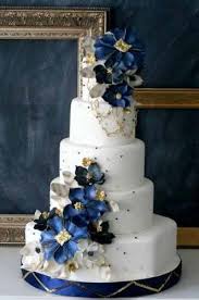 White Fondant Icing With Blue Flowers And Silver Accents Gold Wedding Cake Wedding Cake Pictures Navy Blue Wedding Cakes