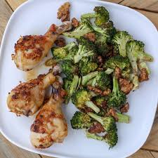 Mealime Sheet Pan Asian Chicken Drumsticks With Broccoli Spiced Walnuts Recipe Spiced Walnuts Asian Chicken Chicken Drumsticks