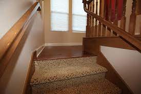 But, cold weather hit before we got around to sanding and staining the handrails, so they sat in the garage until the weather. Fun Carpet On Stairs Carpet Stairs Carpet Stairs To Wood Floor Transition Wood Floor Transition