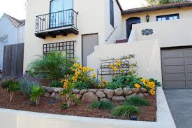 The infinity pool blends seamlessly with the water landscape and splashes over the wall into the weir below. Small Front Yard Landscaping Ideas Hgtv