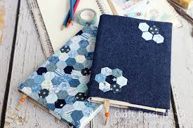 I used pink and teal 12wt thread for the words, and sewed over them again with black thread to make the words pop. Fabric Book Cover Tutorial How To Sew Craft Passion