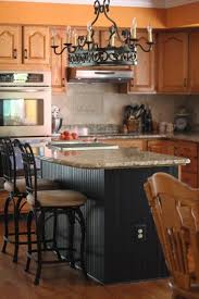 No one expects to see black cabinets or accessories in an oaky kitchen, but there you are. Like The Wall Oven And Stovetop Config Also Like The Oak Cabinets With The Black Island Beadboard Kitchen Kitchen Renovation Oak Kitchen