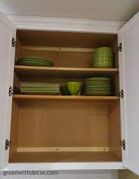 You can also hang heavy kitchen tools at the end of kitchen cabinet, by using pegs or hooks, so next time they will be easy to grab and put away… Get Extra Storage In The Kitchen Cabinets Green With Decor