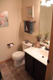 This tiny bathroom is made to feel much larger by the inclusion of mirror all around the room. Pin By Heather Misiewicz On Bathroom Ideas Living Design Tan Bathroom Pallet Home Decor