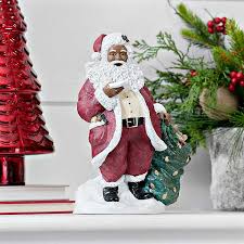 • measures approximately 11 tall, 7 wide, and 5 deep • has an darker skin tone • features santa. African American Santa With List Figurine Kirklands