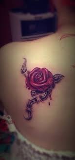 A Bleeding Rose Tattoo Design On The Back Shoulder Tattoos For Women Tattoo Designs For Girls Rose Tattoos For Girls