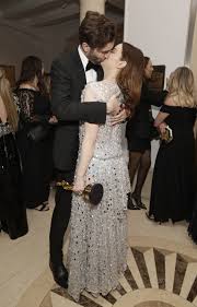 Emma Stone kisses husband Dave McCary at Oscars 2024 party