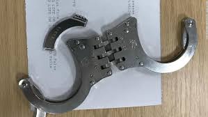 To utilize the carabiner hook, twist open the safety lock. Police Officer Freed By Firefighters After Getting Stuck In His Own Handcuffs Cnn