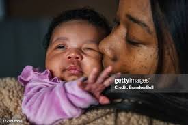 Jennifer Collis makes Thanksgiving dinner while talking with family... News  Photo