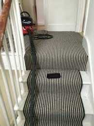 Henry The Vacuum Cleaner Makes His Appearance On The Black And White Striped Carpets Striped Stair Runner Carpet Runner Striped Carpets