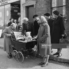 Admiring Baby And Pram In The 1950 S A Tradition Was To Give A New Born Baby A Silver Coin For A Lucky Life Vintage Pram Baby Memories Baby Buggy