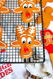 Combine the confectioners' sugar and turn the gingerbread man upside down so it is standing on its head; Reindeer Gingerbread Cookies Upside Down Gingerbread Man Reindeer Cookies Big Bear S Wife