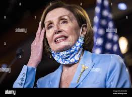 Washington, DC, USA. 6th May, 2021. Pictured: Brenda Joyner, mother of Trey  Joyner who was killed by police, enjoys a performance by gospel singer  Robin Sugar Williams during a rally in which