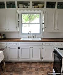 Kitchen cabinet doors get a lot of wear. Painting Kitchen Cabinets Before After