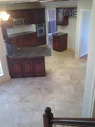 Maybe you would like to learn more about one of these? New Travertine Floor Laid On A 45 Degree Angle And Cabinets Stained A Darker Color Turn An Outdated Kitchen To A Modern Staining Cabinets Display Homes Kitchen