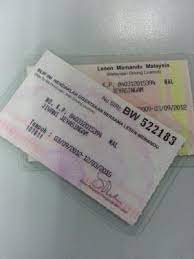 Business man waiting for a call. Myeg Driving License Renewal