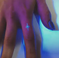 A uv tattoo, also known as a black light tattoo, is a pretty new way to get inked and can look what makes uv tattoos what they are is the chemical mixture used in the ink. On Twitter Her New Uv Tattoo Kinda Looks Like The Captain Marvel Logo