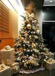 When we talk about christmas, our thoughts immediately fly to the beautifully decorated christmas trees adorning each home, shopping complex, malls each christmas tree would be completely different and remarkable in their own sense and leave the people spellbound seeing each creation. Gold Christmas Tree Gold Christmas Tree Decorations Elegant Christmas Trees Gold Christmas Tree