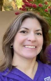 Family's space shuttle wagon and signs for the march