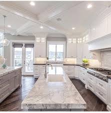 white stone counter, white cabinets