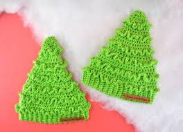 It uses basic crochet stitches, assembled in a fun way, to create a graphic, adorable ornament! Crochet Christmas Tree Hats Free Pattern Christmas Tree Hat Crochet Christmas Hats Christmas Crochet