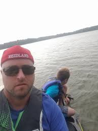 Tree floating in East Bay near North side, removal efforts by community